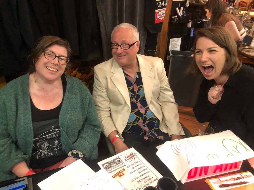 But Wait There's More Rasdiothon Gig at Sooki Lounge, October 2024. Pic shows Jo, Bret & Sal at our merch table.