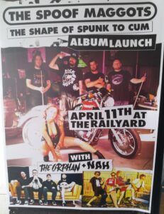 The Spoof Maggots album launch poster. Photo of the band in a shed holding pool cubes with a motorbike and pretty biker chick in front of them. Two small photos of support bands at the bottom.  Writing done in a photocopy cut out of the paper style. 