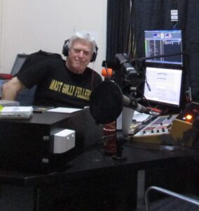 Maestro on the mic wearing Mast Gully Fellers shirt