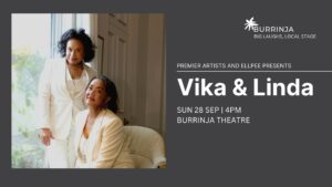Vika & Linda Burrinja gig banner. Colour photo of Vika & Linda dressed in white with one standing and one sitting next to a window. Both looking at the camera with a slight smile. Grey background and white text. 