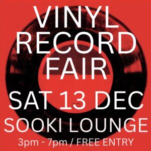 Crate Diggers Record Fair poster. Red background. White text. Graphic of a black vinyl record.